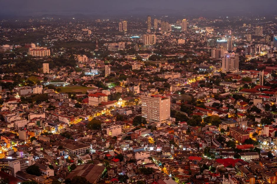 Discover the vibrant evening cityscape of Colombo, Sri Lanka, as viewed from above, showcasing bustling urban life.