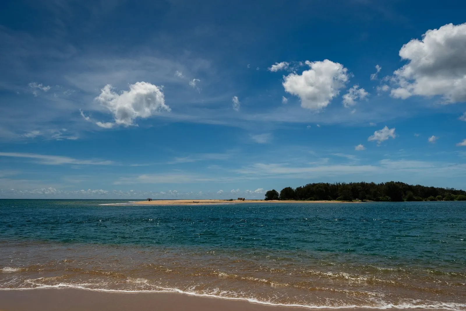 Calm turquoise water and blue sky on a beach in eastern Sri Lanka